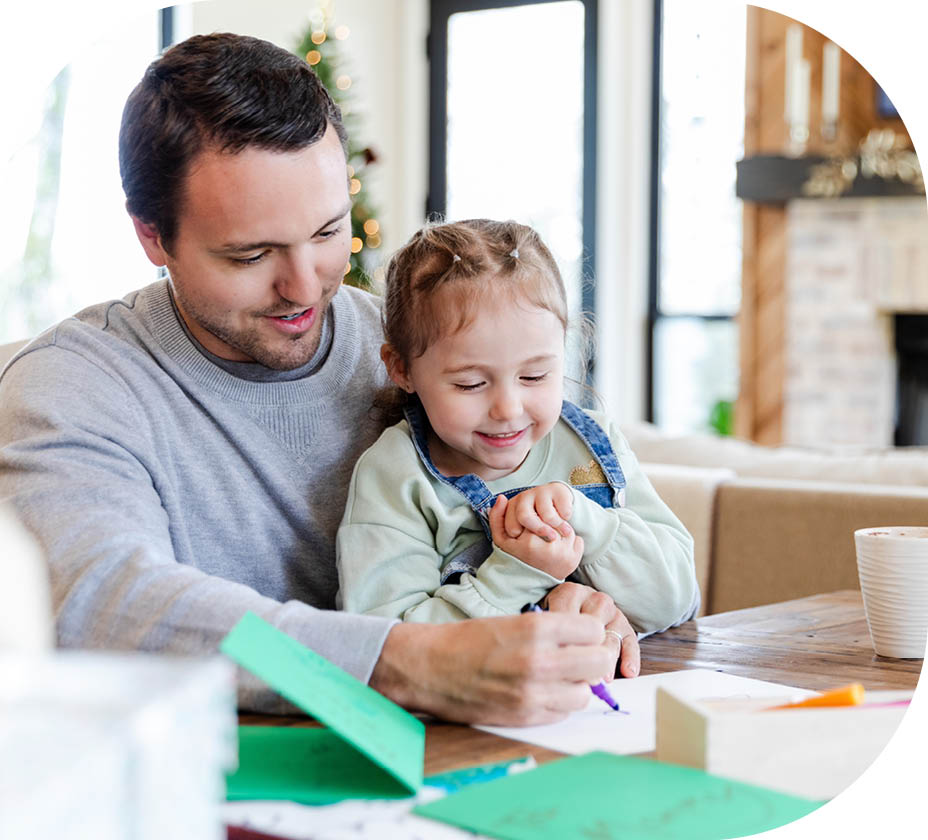 Happy family creating holiday cards. Bonding and togetherness.
